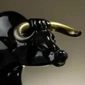 Black ceramic ox sculpture with gold horns, glossy finish, head turned right, detailed features, labeled “black with horns black & gold – ox royal”.