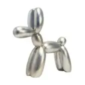 Silver balloon dog sculpture by Juliarte, metallic finish, rounded segments, playful pose, reflective sheen, contemporary design.