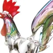 Glass rooster sculpture, transparent with green, blue, purple swirls, red comb, layered purple-green tail, silver eye detail.