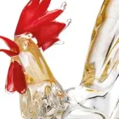 Glass rooster sculpture, translucent gold-flecked body, clear base, red comb, curved tail feathers, detailed form, bright studio lighting.