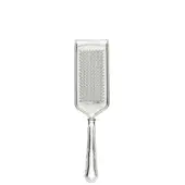 Stainless steel parmesan grater with rectangular grating surface, polished border, and fluted handle, featuring subtle “Cassoni” embossing.