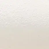 Chalk white textured surface with irregular bumps, a mottled pattern, and a matte finish; soft off-white color gradient.