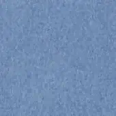 Porcelain surface, light blue color, mottled granular texture with matte finish and even illumination displaying subtle tonal variations.