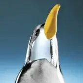 Penguin sculpture, chrome finish, with orange banana beak, white body, gray base, minimalist design, against gradient blue backdrop.