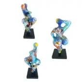 Juliarte "baila" sculptures, translucent resin, dynamic poses with vibrant pop art collage of logos, text, and abstract patterns on black bases.