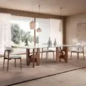Exceptional Pacini & Cappellini Clifford table with a polished natural marble top and satin sheen Canaletto walnut base