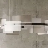 Chandelier, satin white and smoke gray, rectangular and trapezoidal shades with dark gray metal framework, asymmetrical geometric design.