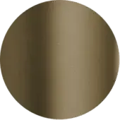 Circular brass disc with matte finish centered on muted green, exhibiting tonal variations and a soft, diffused edge.