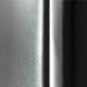 Textured surface with brushed silver, polished chrome, and matte black vertical sections displaying contrasting light reflection and material finishes.
