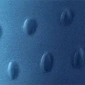 Blue embossed texture with repeating oval patterns, matte finish, granular surface, and diffused lighting in a close-up composition.