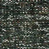 Textile with repeating organic shapes in dark green, white, orange, and teal; nubby knit texture with a raised, uneven surface.