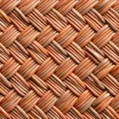 Woven rattan texture displaying reddish-brown elongated strips in a diagonal grid pattern, with a matte finish and subtle tonal variations.