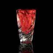 Glass vase, polished orange, twisted form with translucent upper section blending to clear swirling glass and textured spiral base.