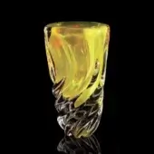 Sculptural glass vase, layered yellow glass, twisted base with angular protrusions, cylindrical upper section, glossy polished finish.