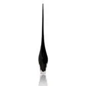 Black glass sculpture, polished finish, elongated teardrop shape with faceted planes and a tapered spire, reflecting on a white surface.