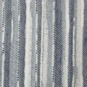 Ceruleo textile sample with vertical dark blue and white stripes, dense woven texture, and subtle twill variations in the blue sections.