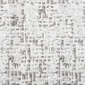 White woven fabric texture with gray and brown threads, displaying a speckled, nubby pattern and matte finish suitable for upholstery.