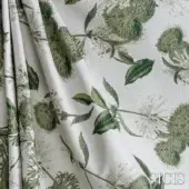 Sicis Botanica fabric in green showcases a repeating botanical pattern with blooms and leaves on a cream, textured weave background.