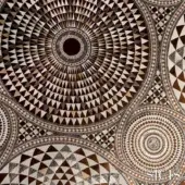 Mosaic pattern, brown and gold tones, concentric circles of triangular tesserae, SICIS Numisma fabric design with layered metallic sheen.