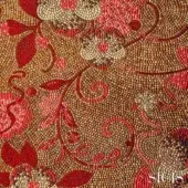 Sicis Dolium fabric mosaic, red and gold floral tessellation, intricate tilework with swirling vines, warm brown background, SICIS branding.