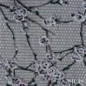 Cherry blossom textile with white, silver, and purple flowers on a gray tiled background, featuring SICIS branding.