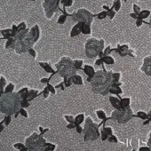 Gray mosaic pattern with floral motifs, black and white details, against a gray tesserae background; SICIS brand, Xante silver fabric.