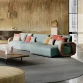 Sophisticated Sicis Liberti sectional upholstered in muted teal textile with sculpted satin finish solid timber armrests