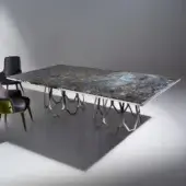 Distinguished Sicis Borgia table with dark grey, blue and white marble tabletop and polished metal base built in interconnected angular shapes