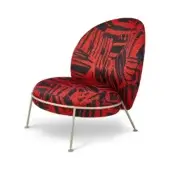 Red & black geometric chair with teardrop back, brushed metal legs, and “puro red” script; modern sculptural design on white background.