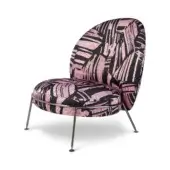 Accent chair, pink and black mosaic pattern upholstery, rounded back, polished metal legs, contemporary design, “puro rose” detail.