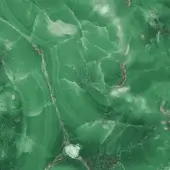 Green onyx slab, Sicis Vetrite Emerald, displaying swirling patterns of emerald and translucent green tones with white and reddish-brown veining.