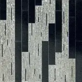 Mosaic artwork, grey and black, features vertical rectangular panels with textured light grey tesserae and solid black sections, creating a dynamic pattern.