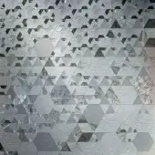 Grey mosaic texture composed of iridescent fragments in geometric arrangement, displaying subtle shimmer and polished reflective qualities; Sicis Vetrite.