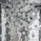Sicis Vetrite mosaic tiles, Perseo Grey finish, hexagonal pattern with irregular pieces and a textured, grayscale aesthetic.