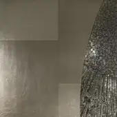 Grey stone-effect tiles and curved mosaic panel, featuring varied grey and silver tones, linear and circular patterns, matte and shimmering textures.