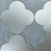Sicis Vetrite mosaic tile, grey mirrored glass, irregular petal shapes against textured grey concrete background.