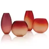 Glass vases, gradient color, rounded and elongated shapes, red, orange, purple, pink, frosted texture, reflective white surface.