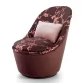Superior Sicis Blossom lounge chair with contemporary floral textile upholstery and gently rotating coated metal base