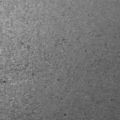 Anthracite cement texture displaying a dense, granular pattern in dark gray tones with subtle tonal variations and uneven surface detail.