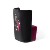 Black velvet accent chair with curved back, featuring gold and pink paradise bird embroidery, burgundy velvet seat upholstery.
