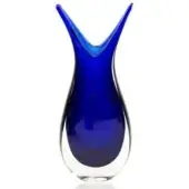 Blue glass Fifi vase, elongated silhouette, transitioning from saturated color to clear glass, polished reflective surface, sculptural form.