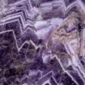 Corundum slice, deep purple, layered geological structure with angular lavender and cream bands, crystalline texture, glossy reflective finish.