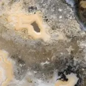 Crystallized agate texture displaying swirling beige, tan, and gray layers with circular inclusions and a matte, granular finish.