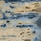 Banded onyx surface displaying concentric layers of beige, tan, blue, and gray with swirling patterns, translucent qualities, and a polished reflective finish.