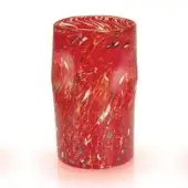 Red glass vase with spotted pattern, cylindrical shape, and swirling gold accents, displayed in a bright studio setting.