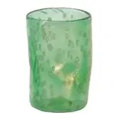 Green glass tumbler with gold inclusions, organic shape, textured surface, and uneven rim against a white backdrop.