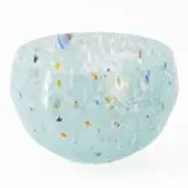 Turquoise glass bowl with speckled pattern, rounded shape, and matte finish, featuring embedded yellow, blue, green, orange, and black fragments.