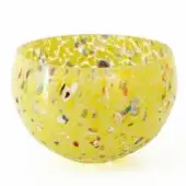 Glass bowl, pea green with speckled inclusions, rounded asymmetrical shape, studio lighting, white background, reflective surface.