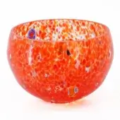 Glass bowl, orange-red with white speckles, rounded shape featuring embedded blue, yellow, and black glass inclusions and fish motifs.