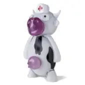 Cow figurine, white resin, black spots, wearing a white nurse’s cap with a red cross, purple nose and udders, cartoonish eyes.